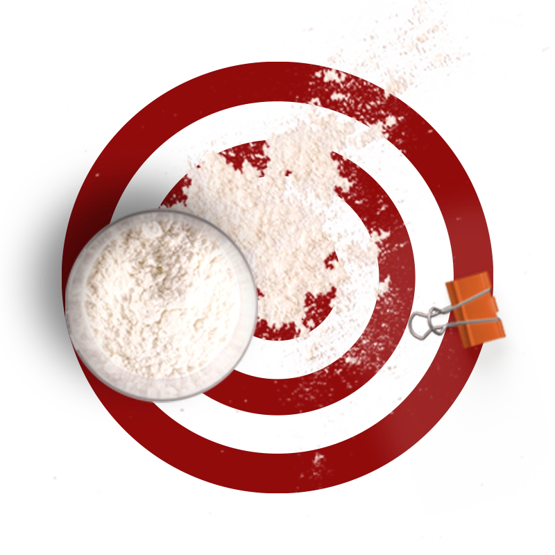 Red concentric circles with a glass of flour and an orange bulldog clip